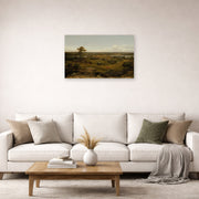 Unframed poster print of Martin Johnson Heade's 'Rocks in New England' displayed on a wall in a living room