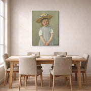 Gallery-wrapped canvas print of Mary Cassatt's Child in a Straw Hat displayed on a wall in a dining room