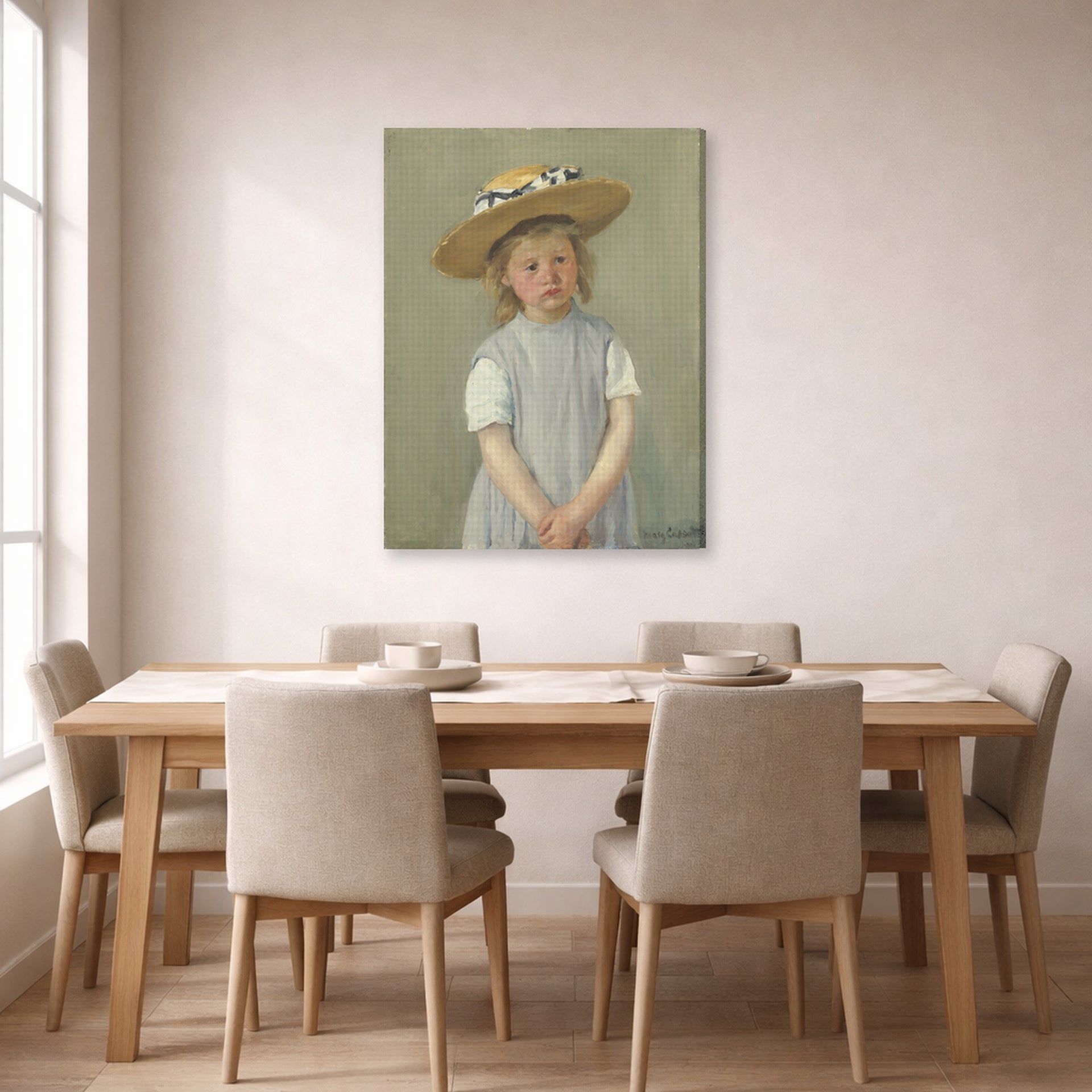 Gallery-wrapped canvas print of Mary Cassatt's Child in a Straw Hat displayed on a wall in a dining room