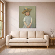 Gallery-wrapped canvas print of Mary Cassatt's Child in a Straw Hat displayed on a wall in a living room