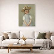 Gallery-wrapped canvas print of Mary Cassatt's Child in a Straw Hat displayed on a wall in a living room