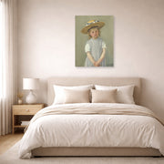 Unframed poster print of Mary Cassatt's Child in a Straw Hat displayed on a wall in a bedroom