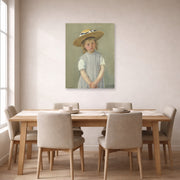 Unframed poster print of Mary Cassatt's Child in a Straw Hat displayed on a wall in a dining room