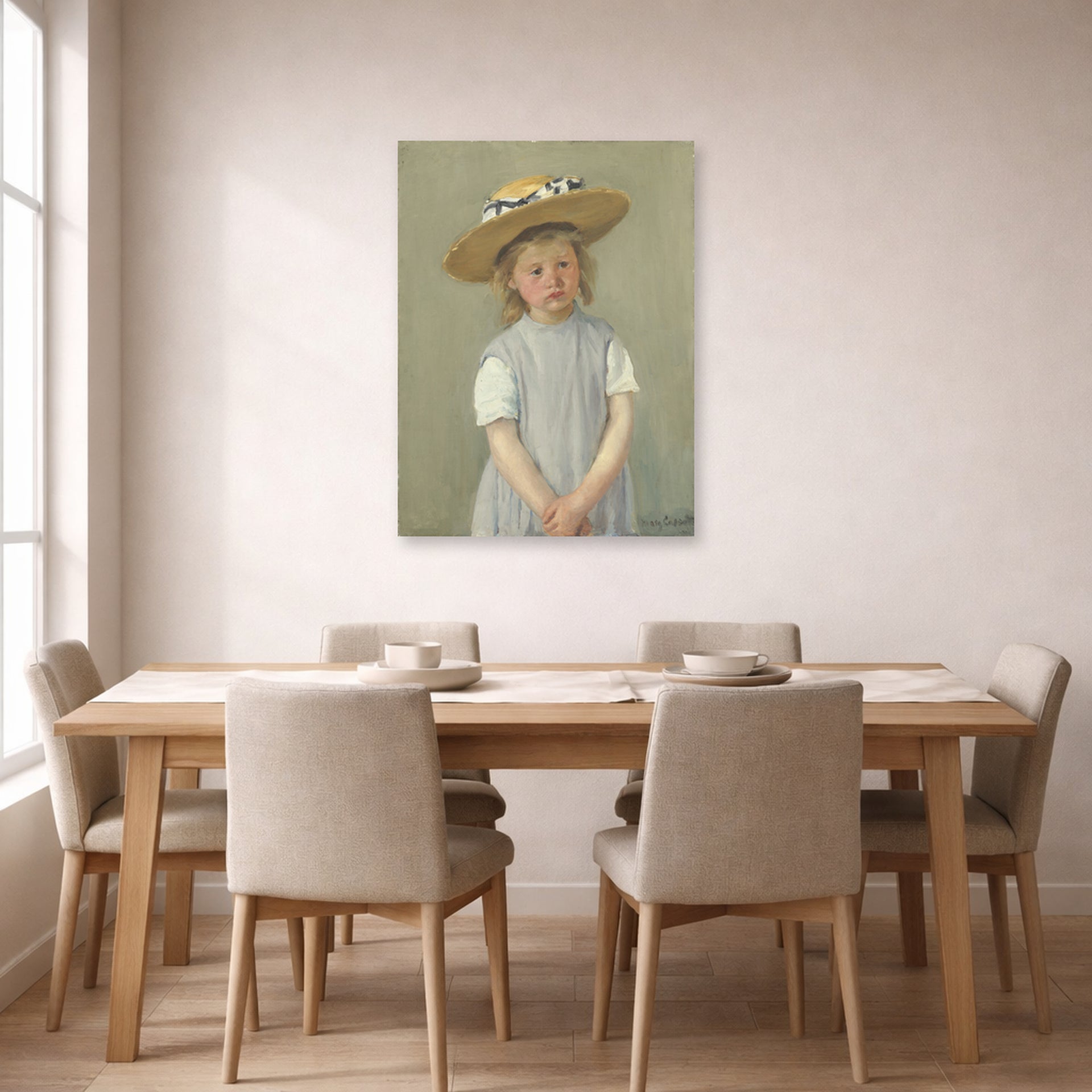 Unframed poster print of Mary Cassatt's Child in a Straw Hat displayed on a wall in a dining room