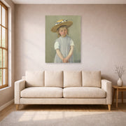 Unframed poster print of Mary Cassatt's Child in a Straw Hat displayed on a wall in a living room