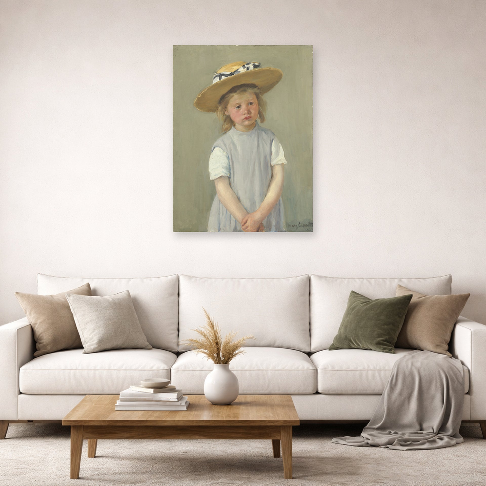 Unframed poster print of Mary Cassatt's Child in a Straw Hat displayed on a wall in a living room