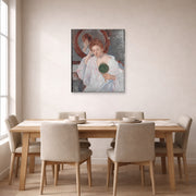 Unframed poster print of Mary Cassatt's Denise at Her Dressing Table displayed on a wall in a dining room