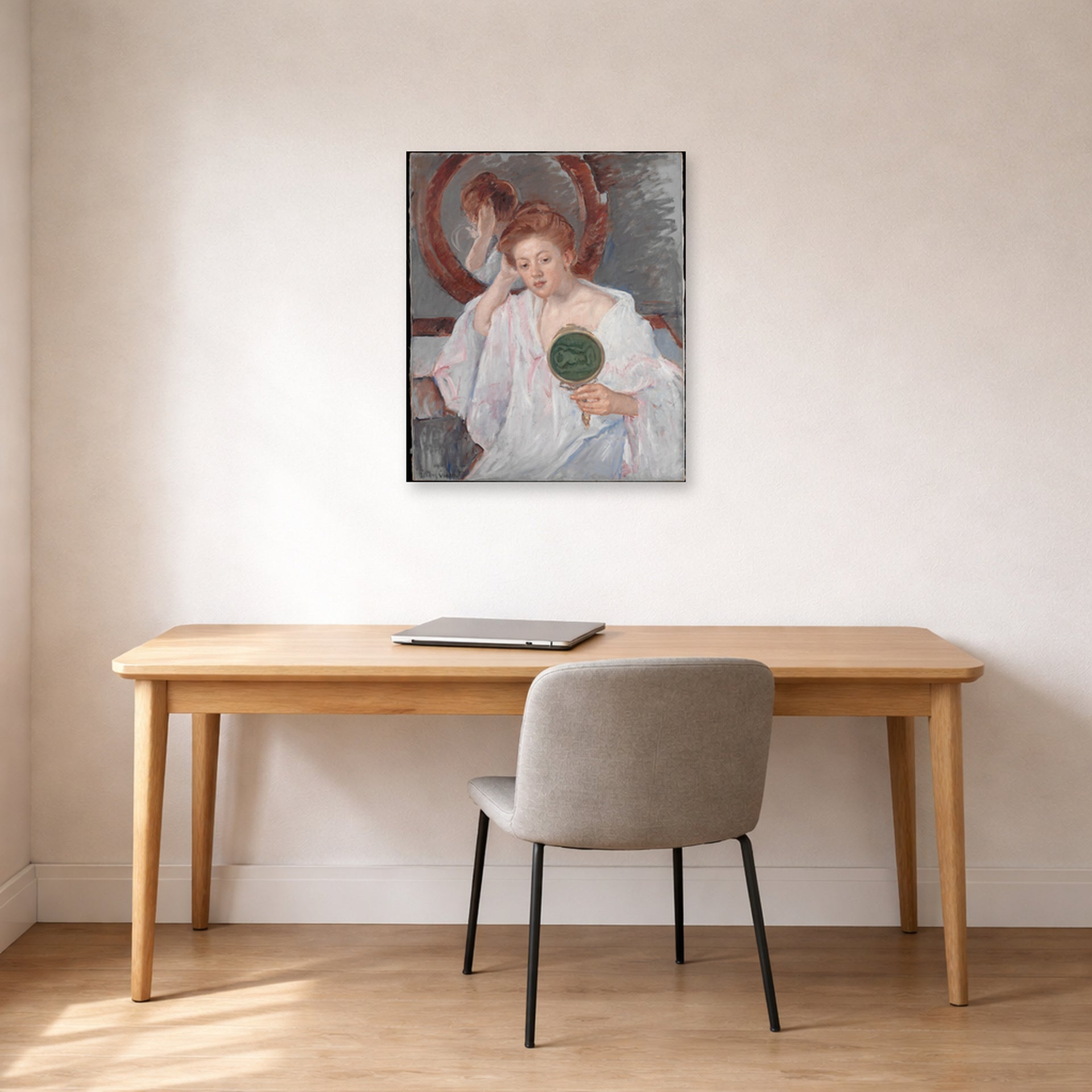 Unframed poster print of Mary Cassatt's Denise at Her Dressing Table displayed on a wall in a office