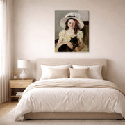 Gallery-wrapped canvas print of Mary Cassatt's Francoise Holding a Little Black Dog displayed on a wall in a bedroom