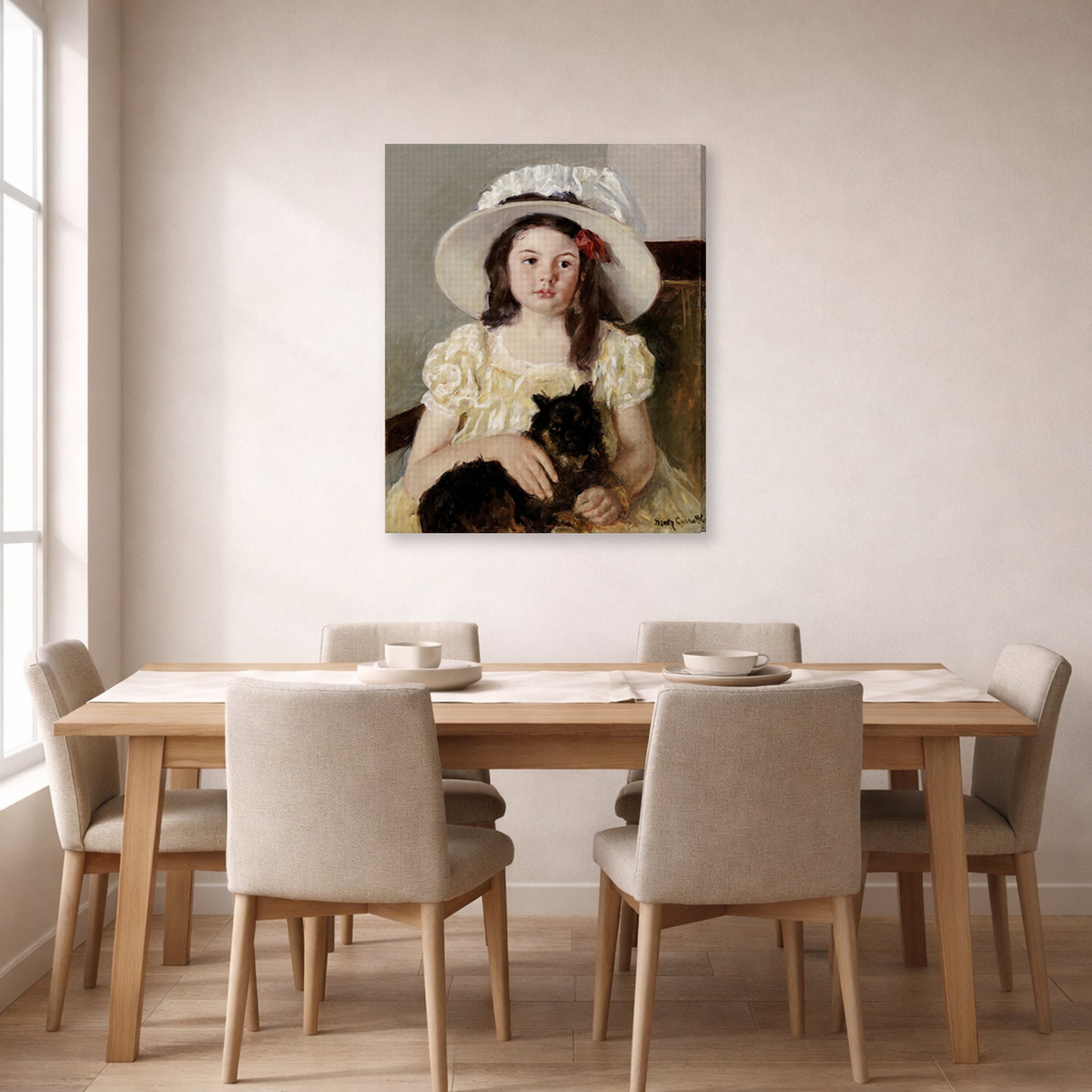 Gallery-wrapped canvas print of Mary Cassatt's Francoise Holding a Little Black Dog displayed on a wall in a dining room