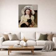 Gallery-wrapped canvas print of Mary Cassatt's Francoise Holding a Little Black Dog displayed on a wall in a living room