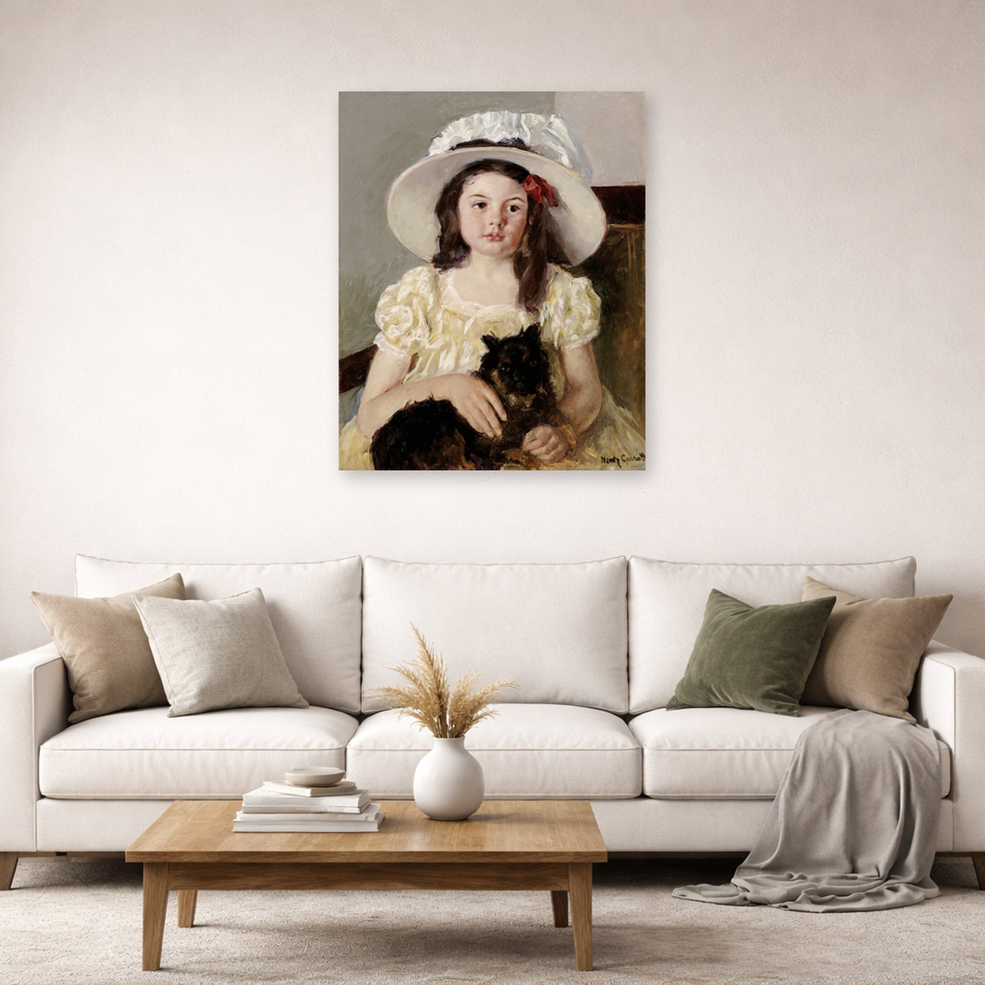 Unframed poster print of Mary Cassatt's Francoise Holding a Little Black Dog displayed on a wall in a living room