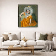 Gallery-wrapped canvas print of Mary Cassatt's Margot in Orange Dress displayed on a wall in a living room