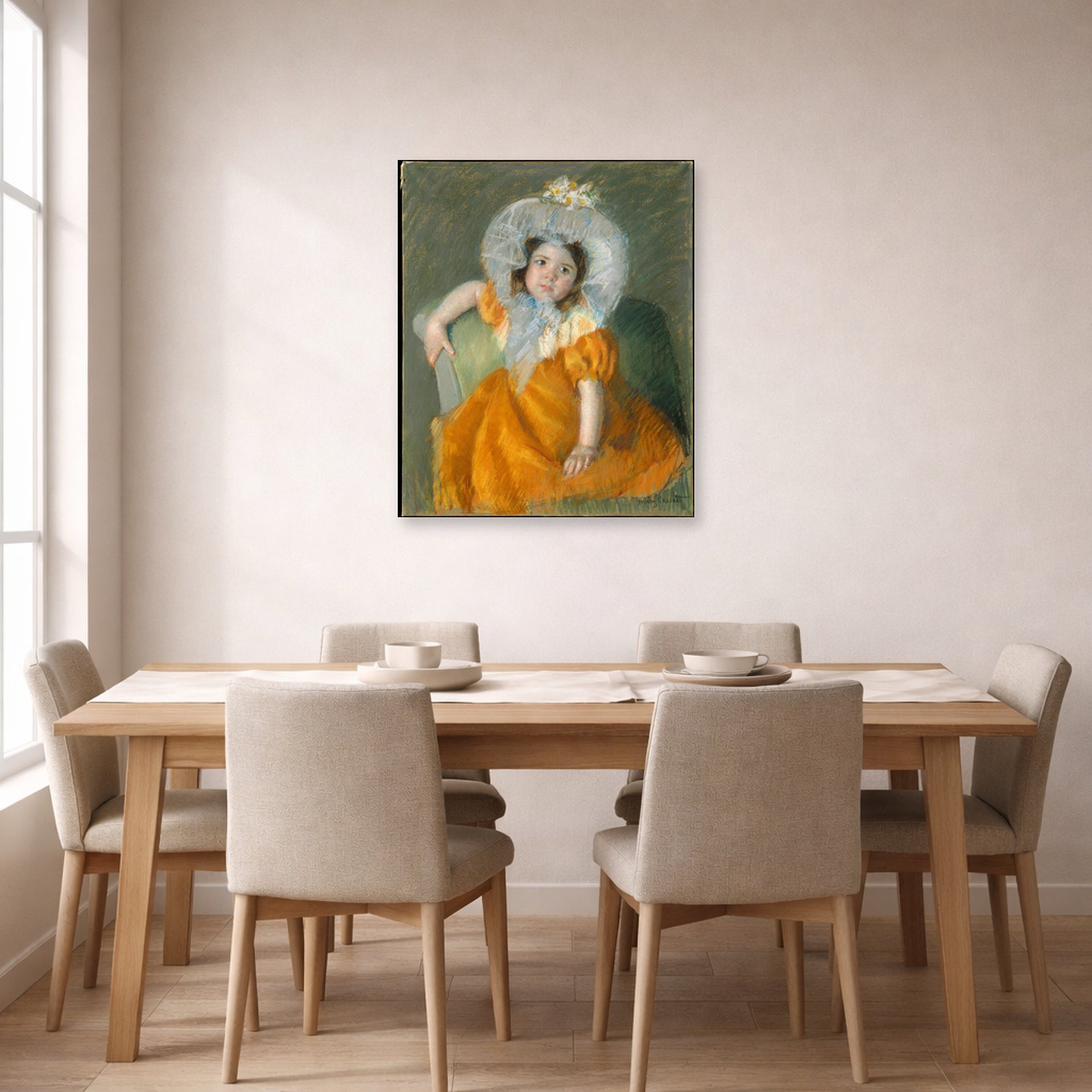 Unframed poster print of Mary Cassatt's Margot in Orange Dress displayed on a wall in a dining room