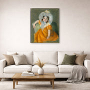 Unframed poster print of Mary Cassatt's Margot in Orange Dress displayed on a wall in a living room