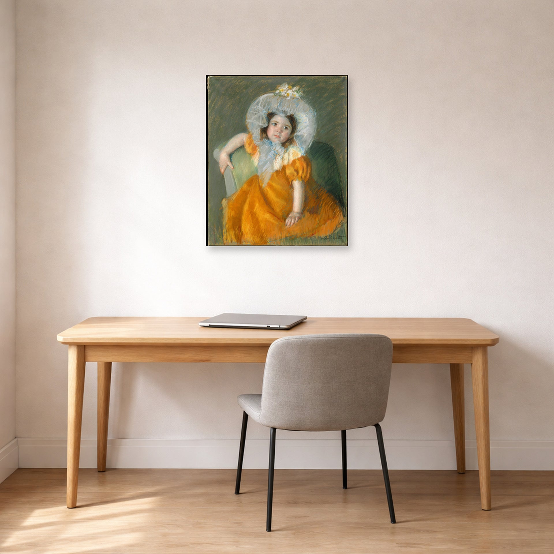Unframed poster print of Mary Cassatt's Margot in Orange Dress displayed on a wall in a office