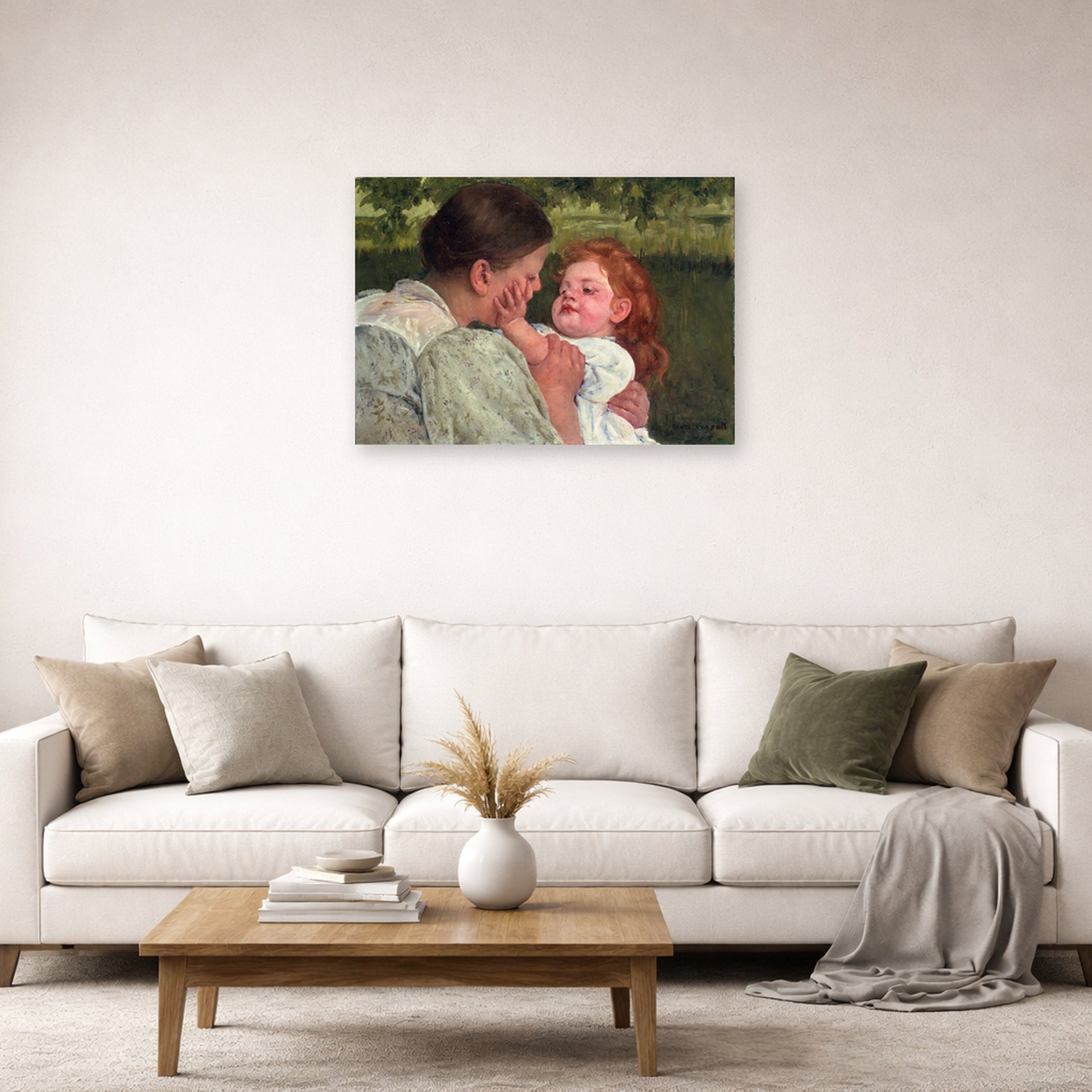 Unframed poster print of Mary Cassatt's Maternal Caress displayed on a wall in a living room