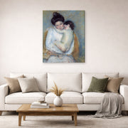 Gallery-wrapped canvas print of Mary Cassatt's Mother and Child displayed on a wall in a living room