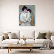 Unframed poster print of Mary Cassatt's Mother and Child displayed on a wall in a living room