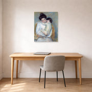 Unframed poster print of Mary Cassatt's Mother and Child displayed on a wall in a office