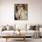 Unframed poster print of Mary Cassatt's Mother and Child (The Oval Mirror) displayed on a wall in a living room