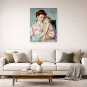Unframed poster print of Mary Cassatt's Sleepy Baby displayed on a wall in a living room