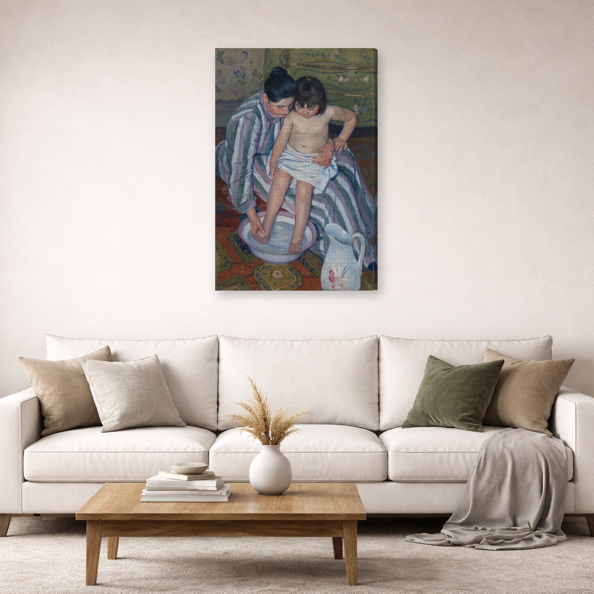 Gallery-wrapped canvas print of Mary Cassatt's The Childs Bath displayed on a wall in a living room