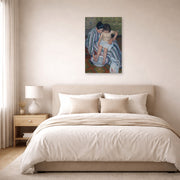 Unframed poster print of Mary Cassatt's The Childs Bath displayed on a wall in a bedroom