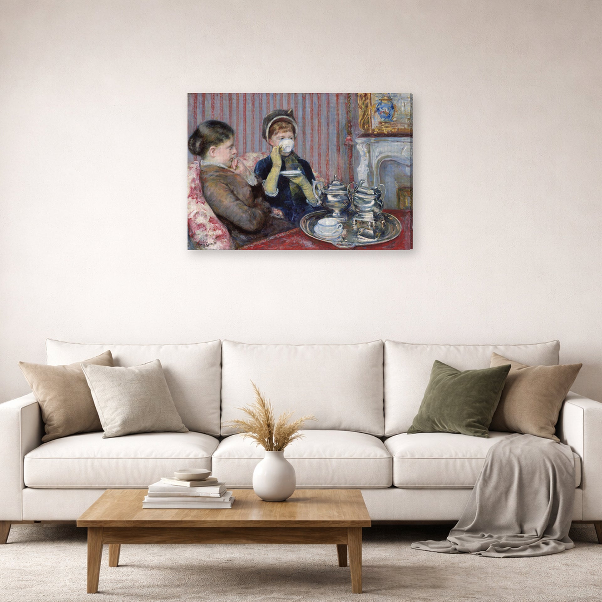 Gallery-wrapped canvas print of Mary Cassatt's The Tea displayed on a wall in a living room