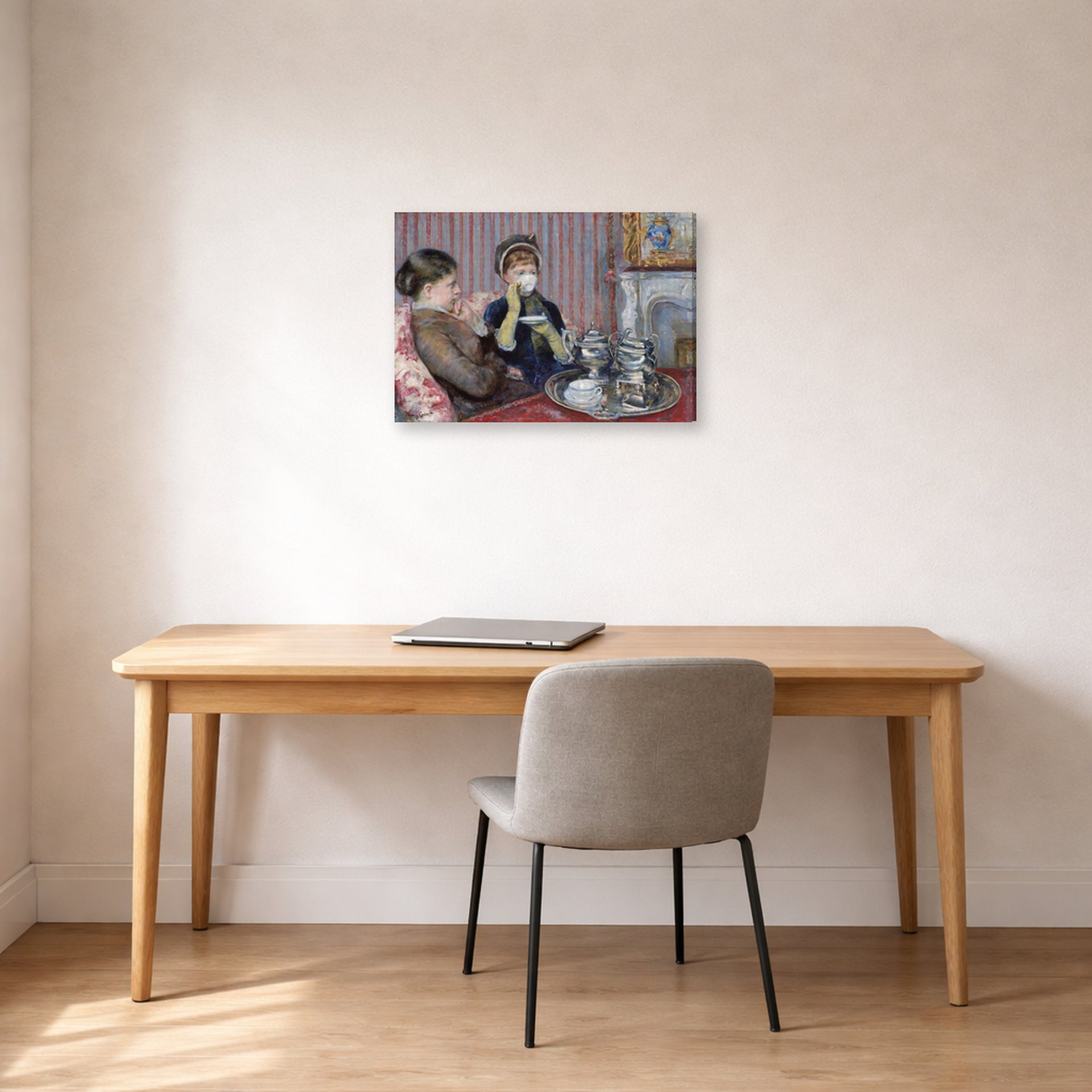 Gallery-wrapped canvas print of Mary Cassatt's The Tea displayed on a wall in a office