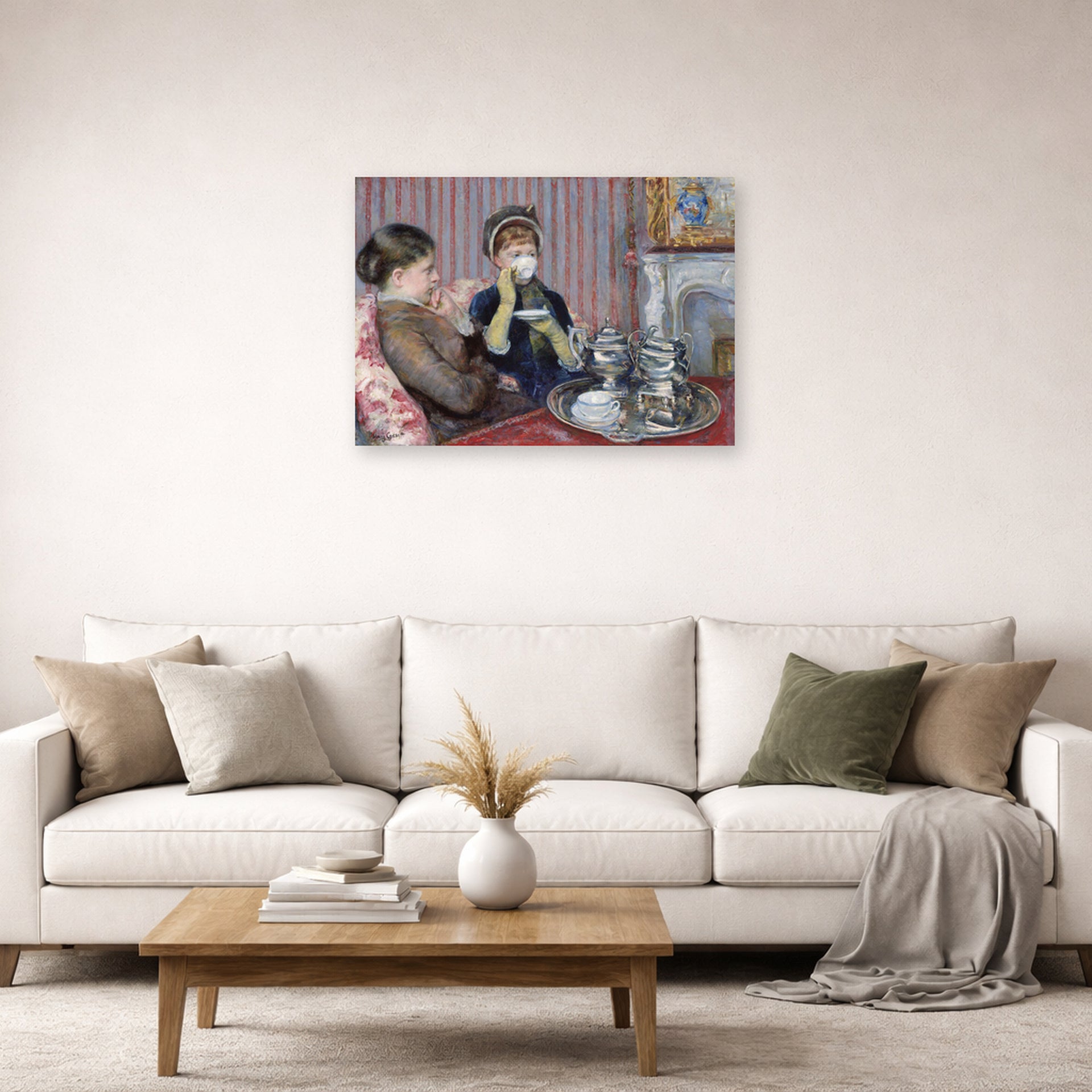 Unframed poster print of Mary Cassatt's The Tea displayed on a wall in a living room