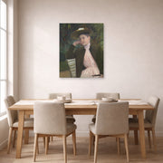 Unframed poster print of Mary Cassatt's Young Girl with a Brown Hat displayed on a wall in a dining room