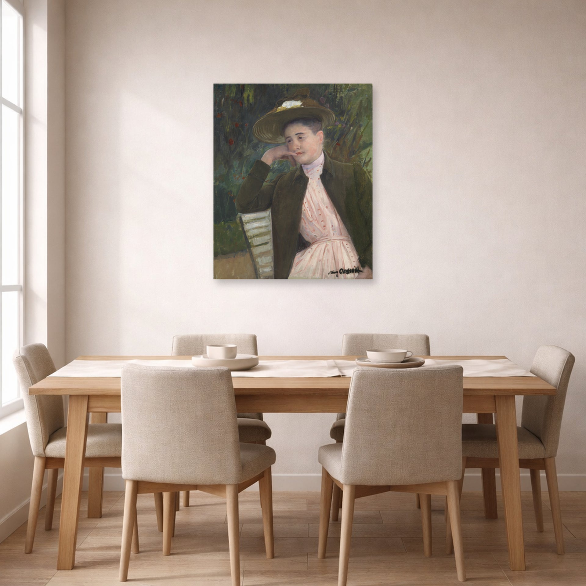 Unframed poster print of Mary Cassatt's Young Girl with a Brown Hat displayed on a wall in a dining room