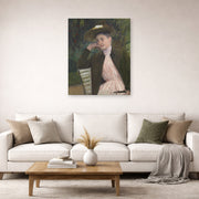 Unframed poster print of Mary Cassatt's Young Girl with a Brown Hat displayed on a wall in a living room