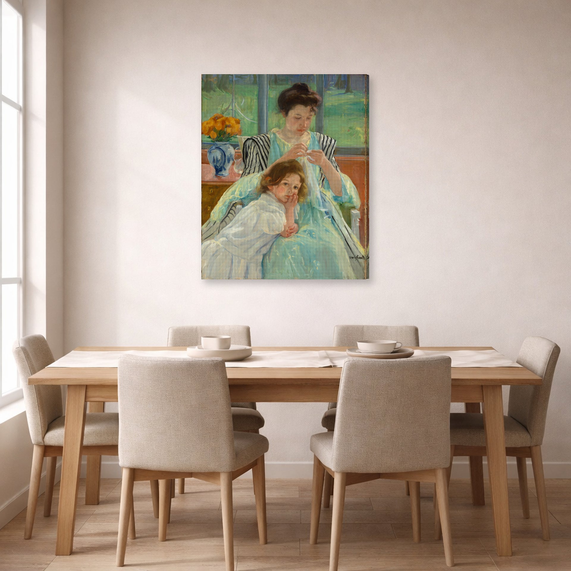 Gallery-wrapped canvas print of Mary Cassatt's Young Mother Sewing displayed on a wall in a dining room