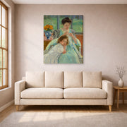 Gallery-wrapped canvas print of Mary Cassatt's Young Mother Sewing displayed on a wall in a living room