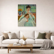 Gallery-wrapped canvas print of Mary Cassatt's Young Mother Sewing displayed on a wall in a living room