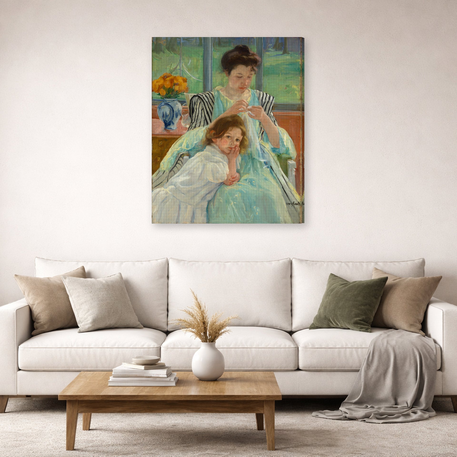 Gallery-wrapped canvas print of Mary Cassatt's Young Mother Sewing displayed on a wall in a living room