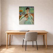 Gallery-wrapped canvas print of Mary Cassatt's Young Mother Sewing displayed on a wall in a office