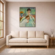 Unframed poster print of Mary Cassatt's Young Mother Sewing displayed on a wall in a living room