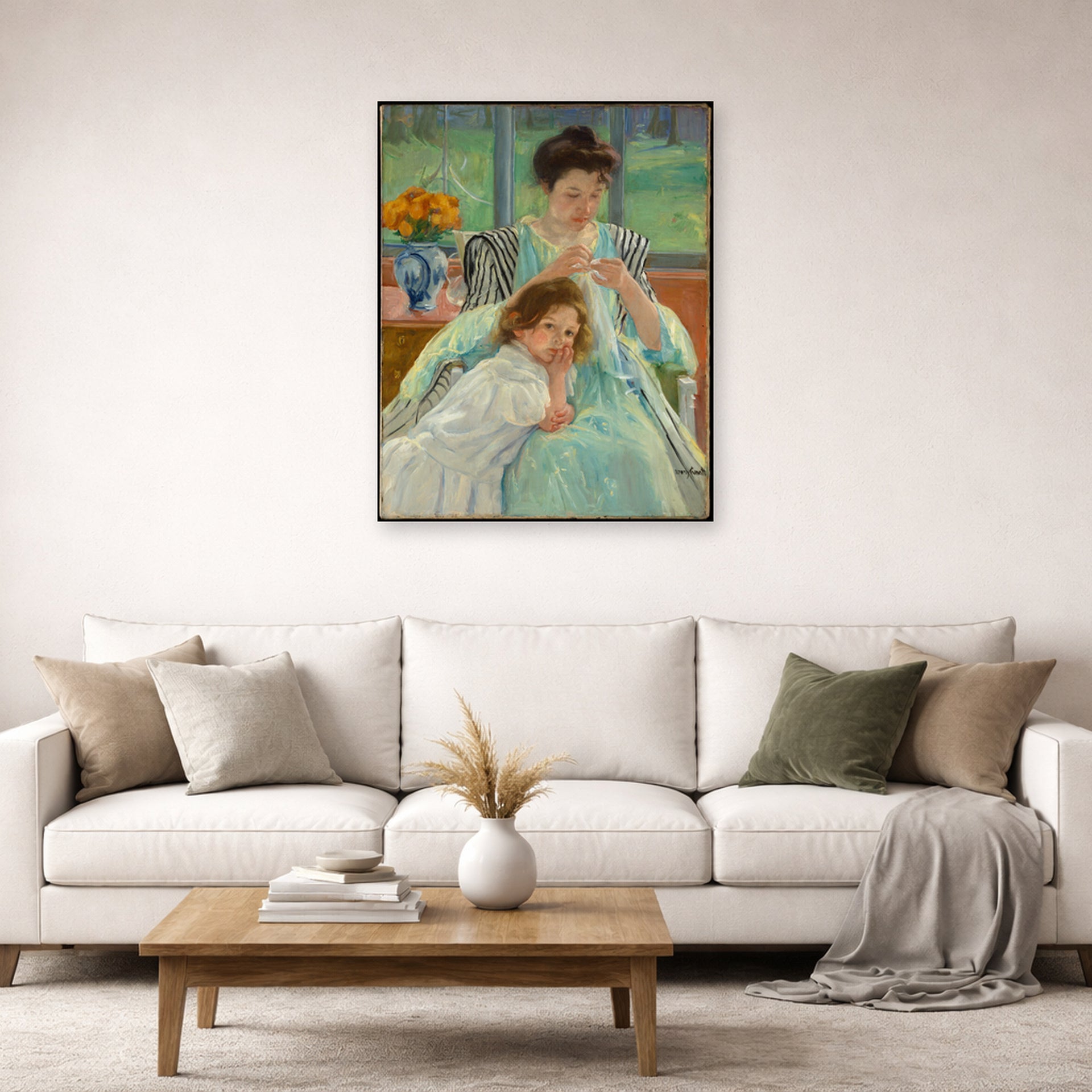 Unframed poster print of Mary Cassatt's Young Mother Sewing displayed on a wall in a living room