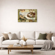 Unframed poster print of Michelangelo's Creation of Adam displayed on a wall in a living room