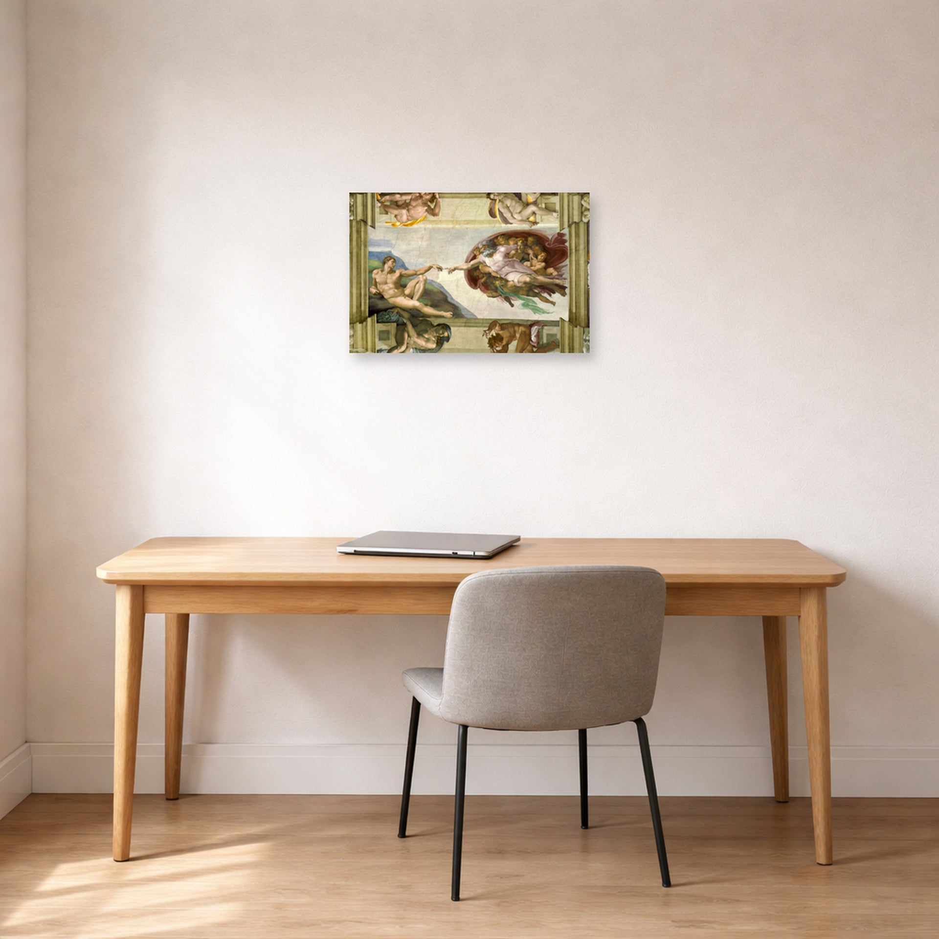 Unframed poster print of Michelangelo's Creation of Adam displayed on a wall in a office