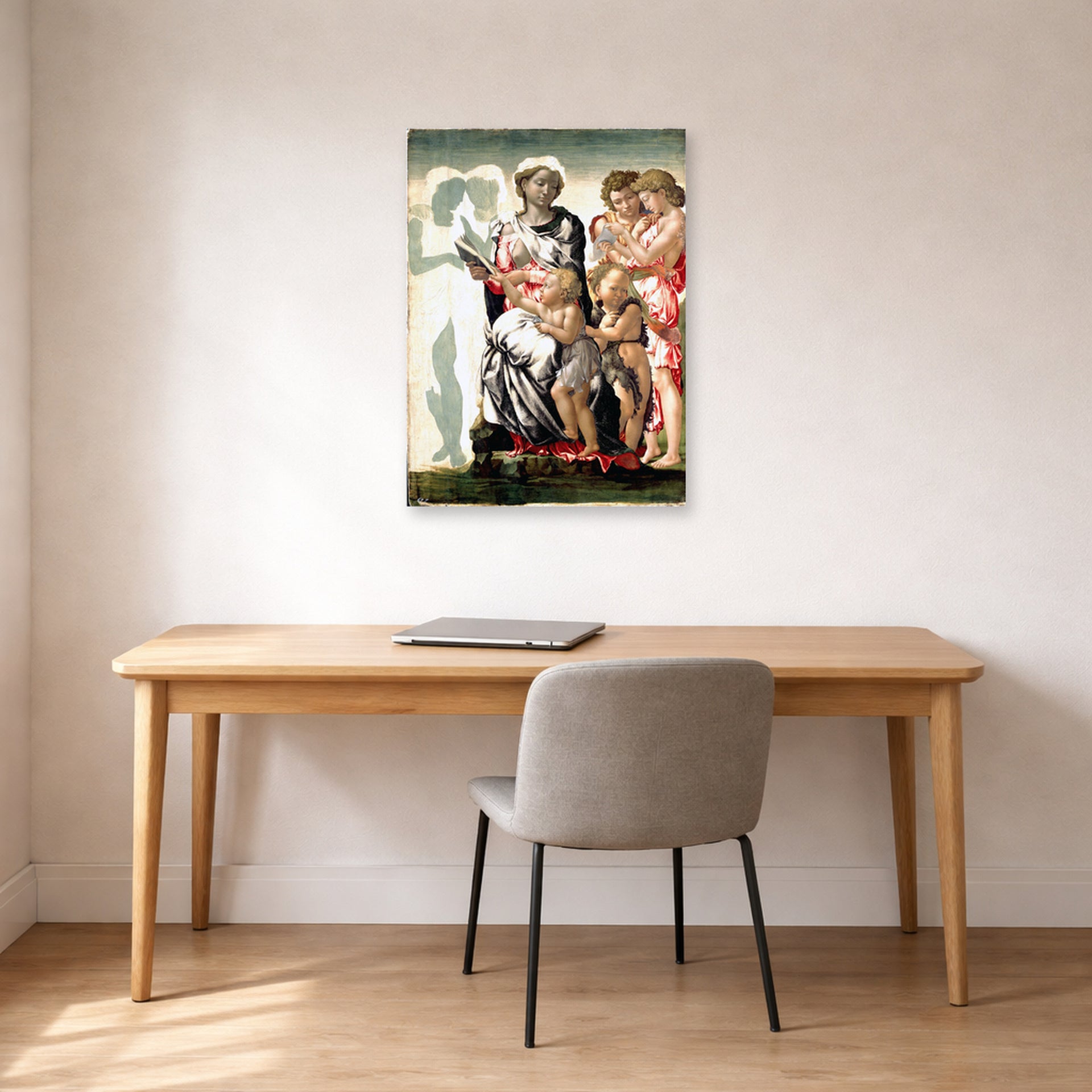 Unframed poster print of Michelangelo's Manchester Madonna displayed on a wall in a office