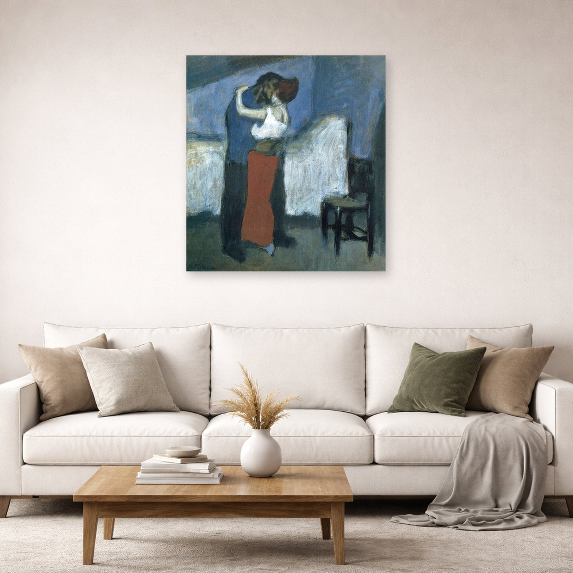 Unframed poster print of Pablo Picasso's 'Embrace' displayed on a wall in a living room