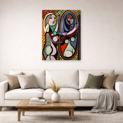 Gallery-wrapped canvas print of Pablo Picasso's 'Girl Before a Mirror' displayed on a wall in a living room