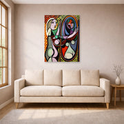 Unframed poster print of Pablo Picasso's 'Girl Before a Mirror' displayed on a wall in a living room