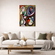 Unframed poster print of Pablo Picasso's 'Girl Before a Mirror' displayed on a wall in a living room