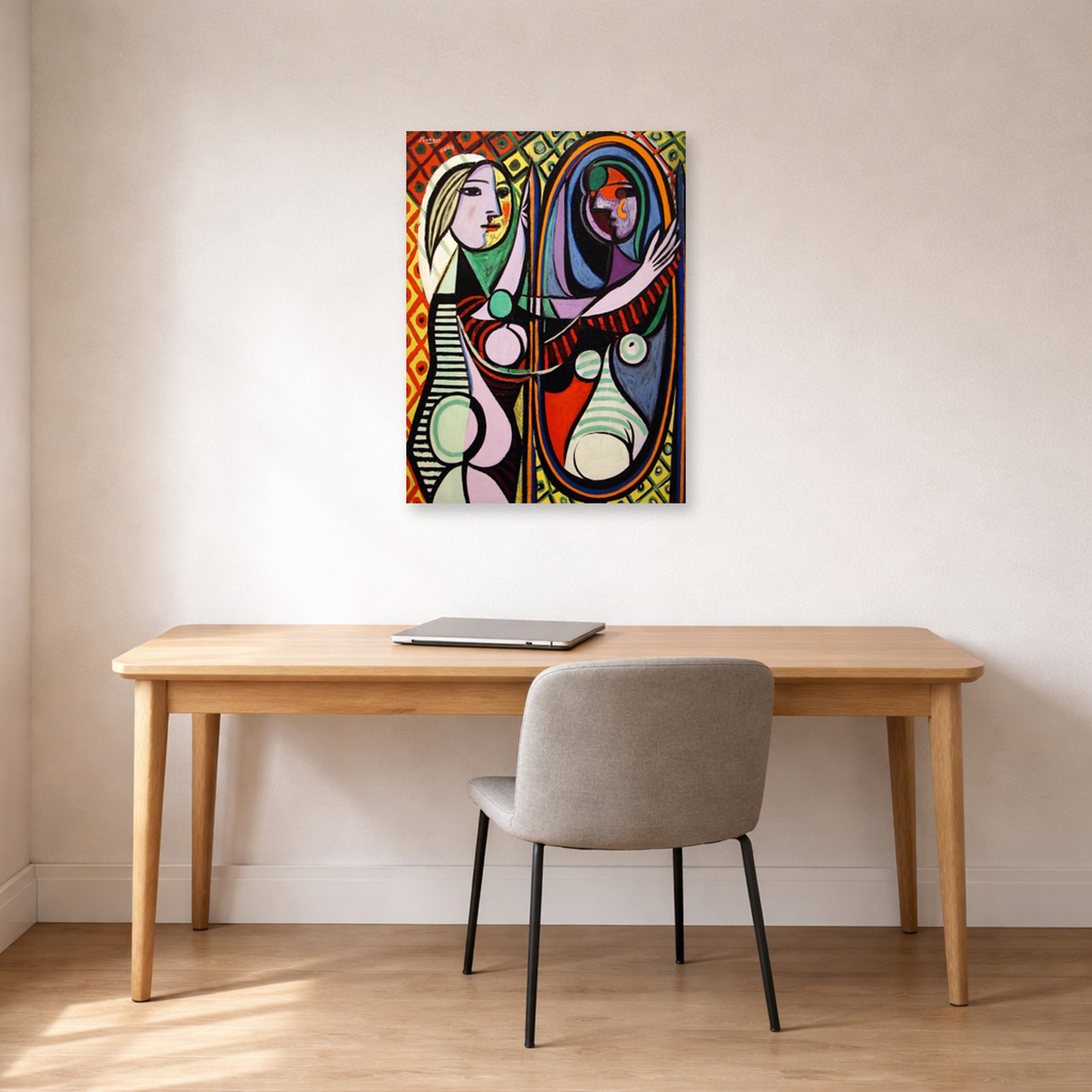 Unframed poster print of Pablo Picasso's 'Girl Before a Mirror' displayed on a wall in a home office