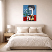Unframed poster print of Pablo Picasso's 'Jacqueline with Flowers' displayed on a wall in a bedroom